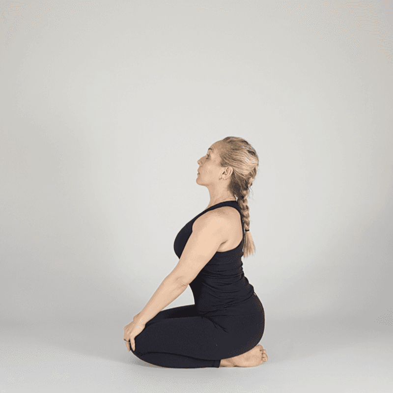 Yoga practitioner performing a seated neck release.