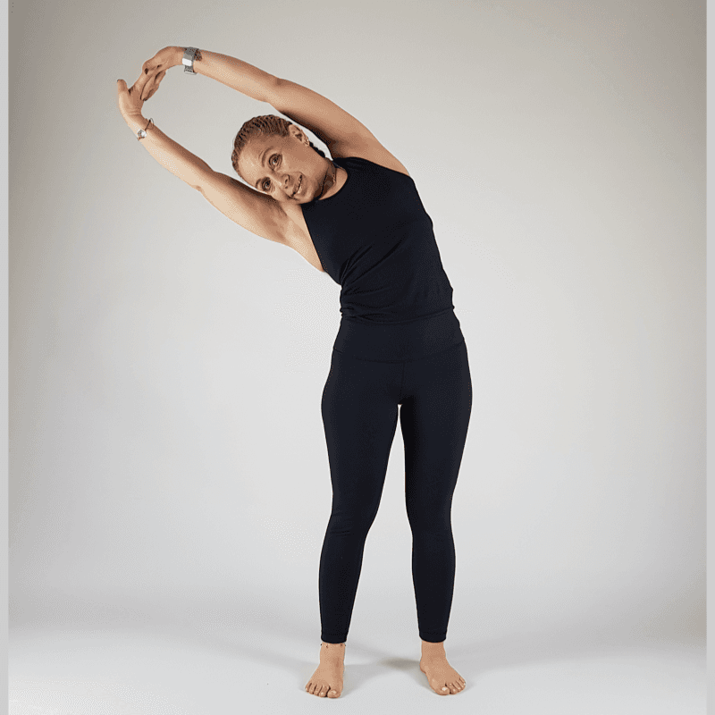 Back view of yoga practitioner in Upward Salute showing spine and shoulder alignment