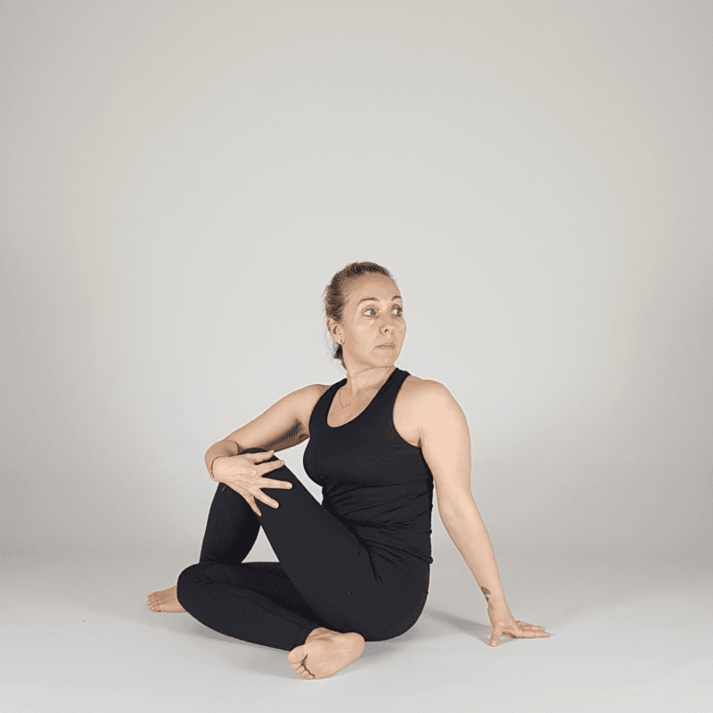 Yoga practitioner performing a bound seated twist.