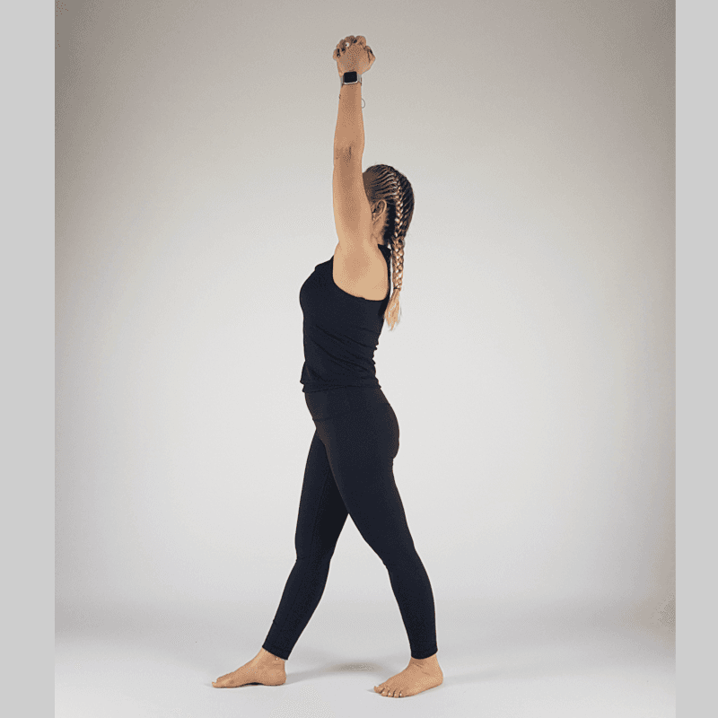 Yoga practitioner in High Lunge with arms reaching overhead
