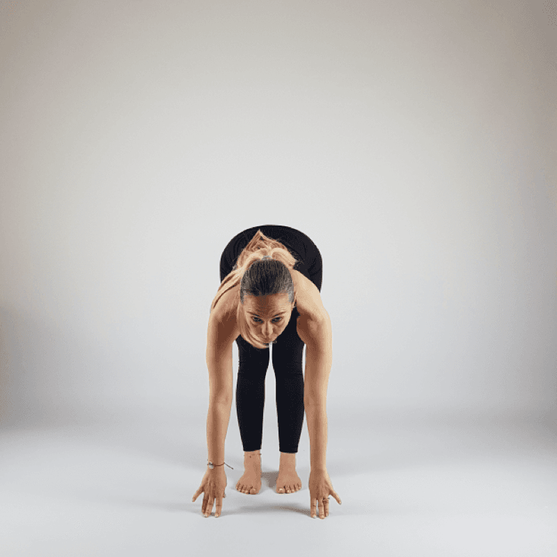 Yoga practitioner in Half Forward Fold with flat back