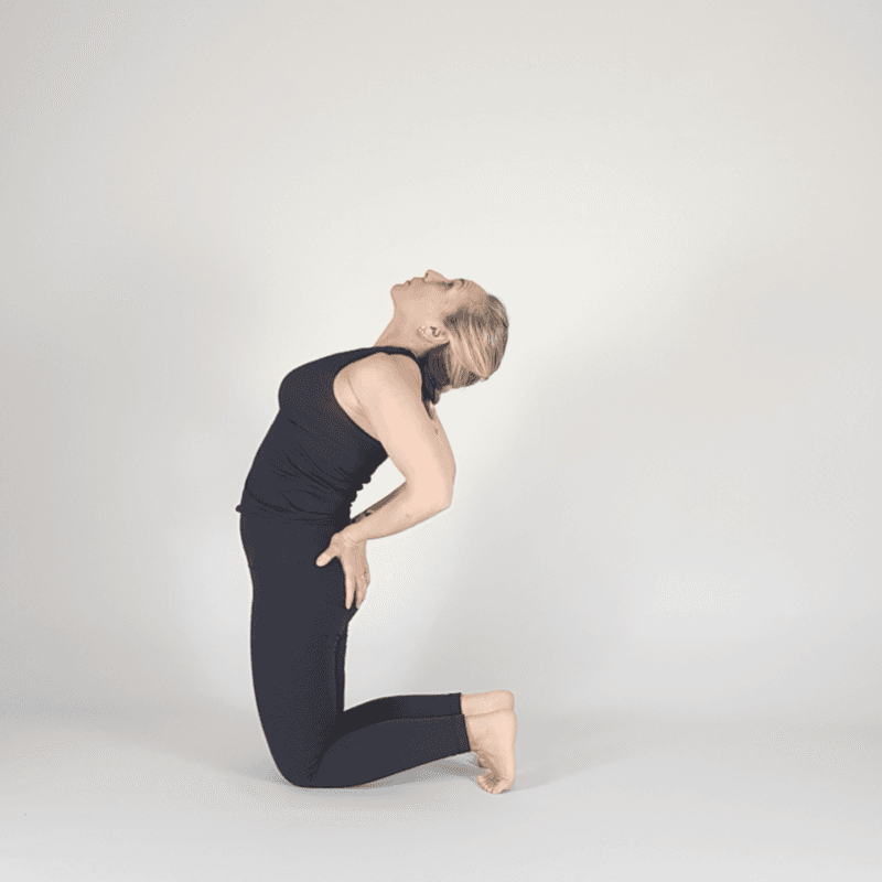 Yoga practitioner in Deep Camel Pose with maximum extension