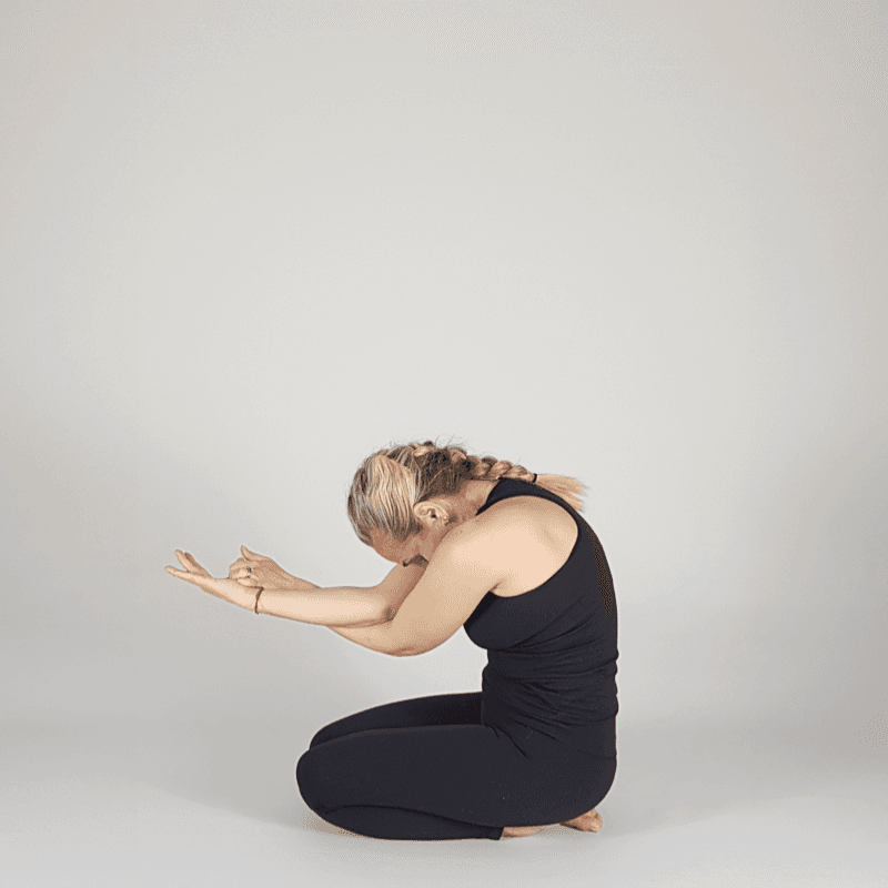 Yoga practitioner seated in integration pose.