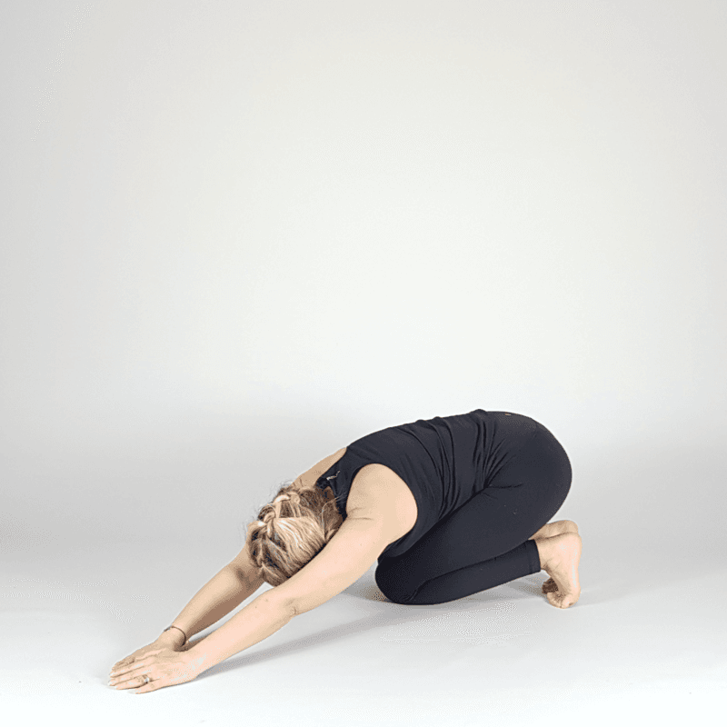 Yoga practitioner in extended child's pose.
