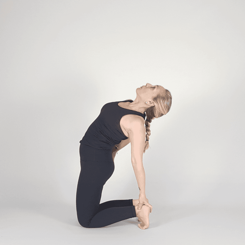 Yoga practitioner in modified Camel Pose variation