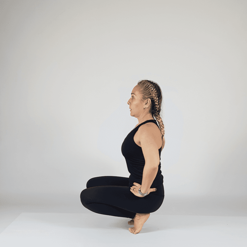 Garland Pose Hands on Hips
