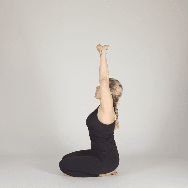 Yoga practitioner seated in grounding pose.