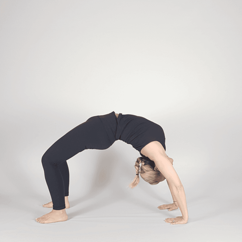 Yoga practitioner in Full Wheel Pose with full backbend