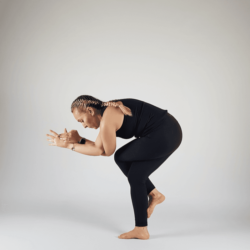 Yoga practitioner in Standing Forward Fold with hands touching the floor