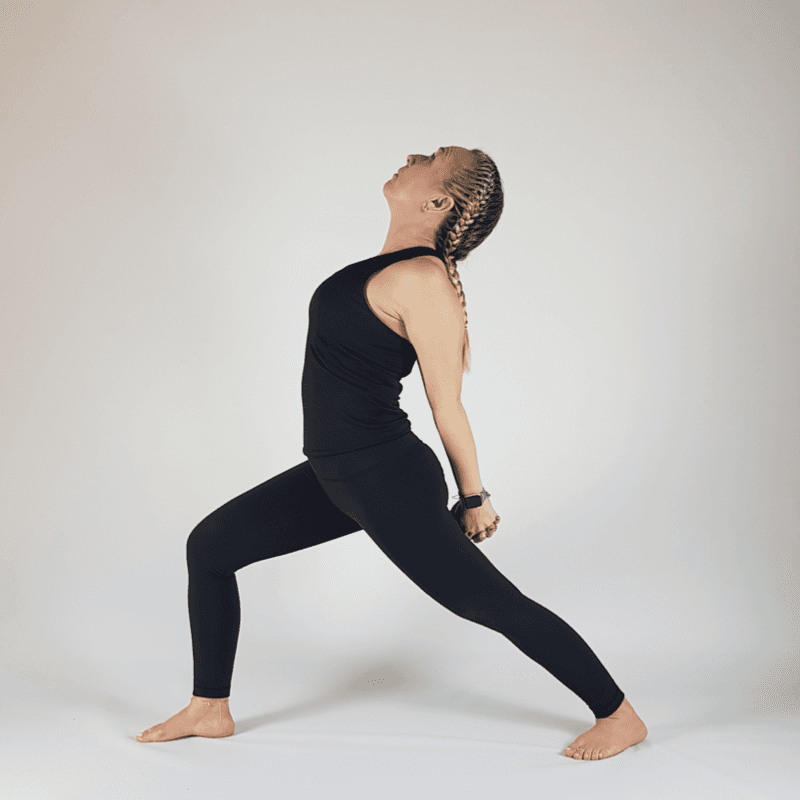 Woman demonstrating a standing Warrior Variation with a backward lean