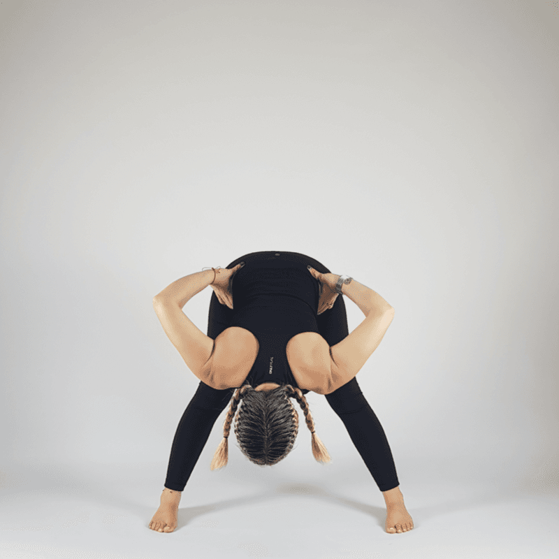 Wide-Legged Forward Fold Hands on Hips