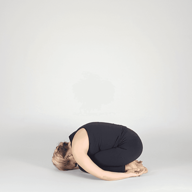 Yoga practitioner resting in Child's Pose.
