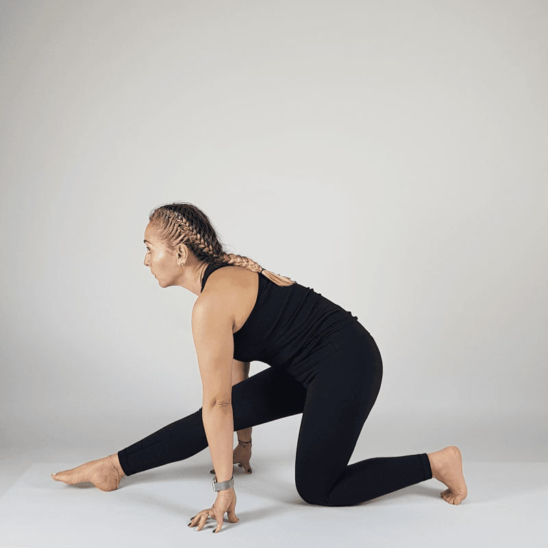 Yoga practitioner in Half Split Pose with front leg extended