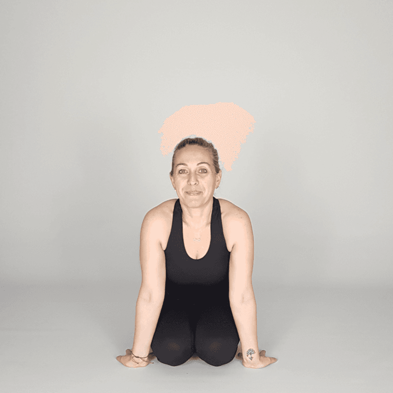 Yoga practitioner seated in Hero Pose.