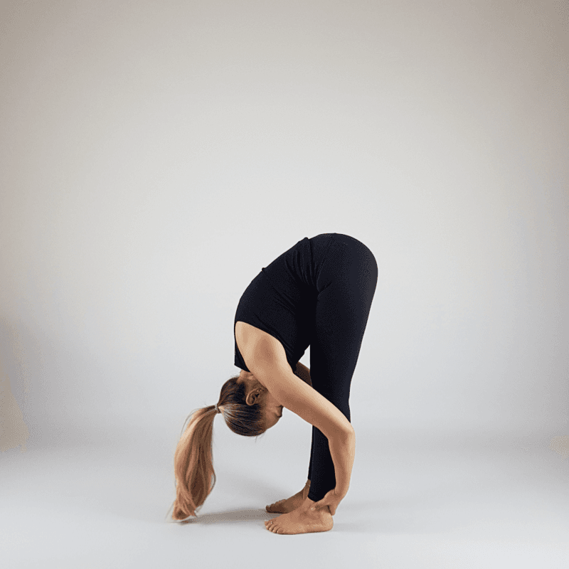 Yoga practitioner in deep forward fold with chest on thighs