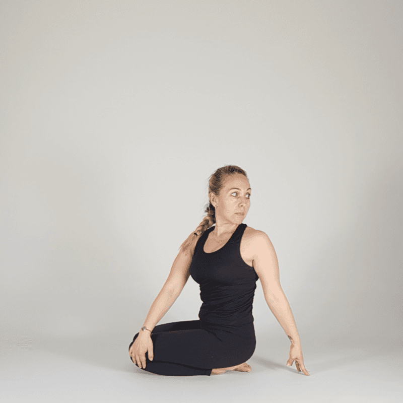Yoga practitioner demonstrating an easy seated twist.