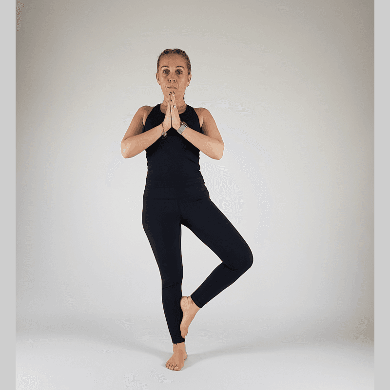 Tree Pose with foot placed low near the ankle for accessibility.