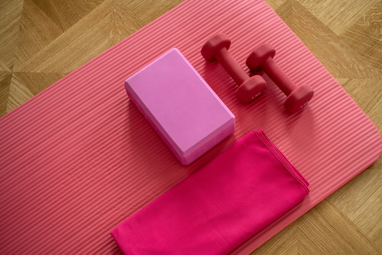 Yoga practitioner in pigeon pose on a sunlit mat