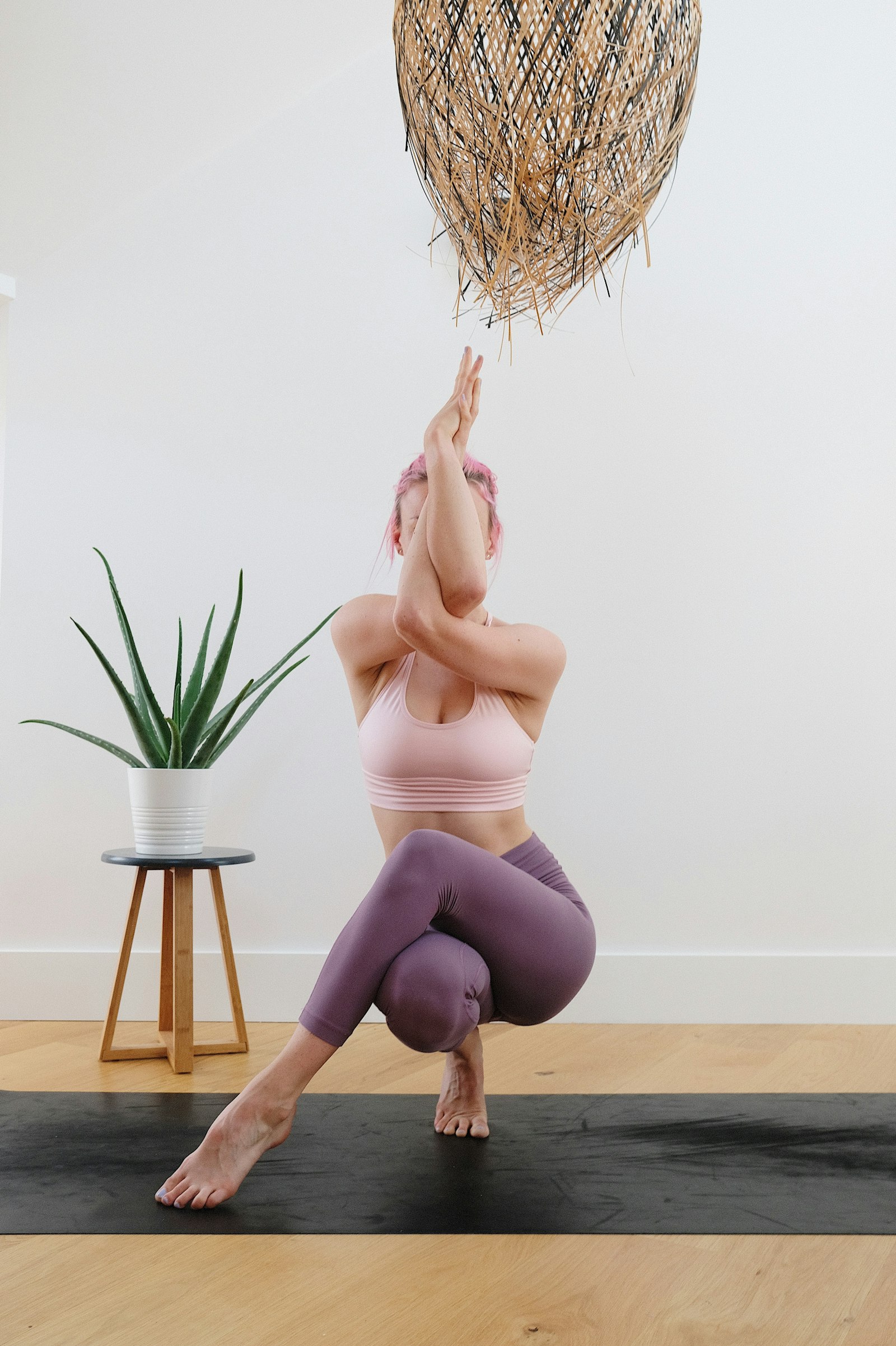 Person doing seated cat-cow with hands behind the head
