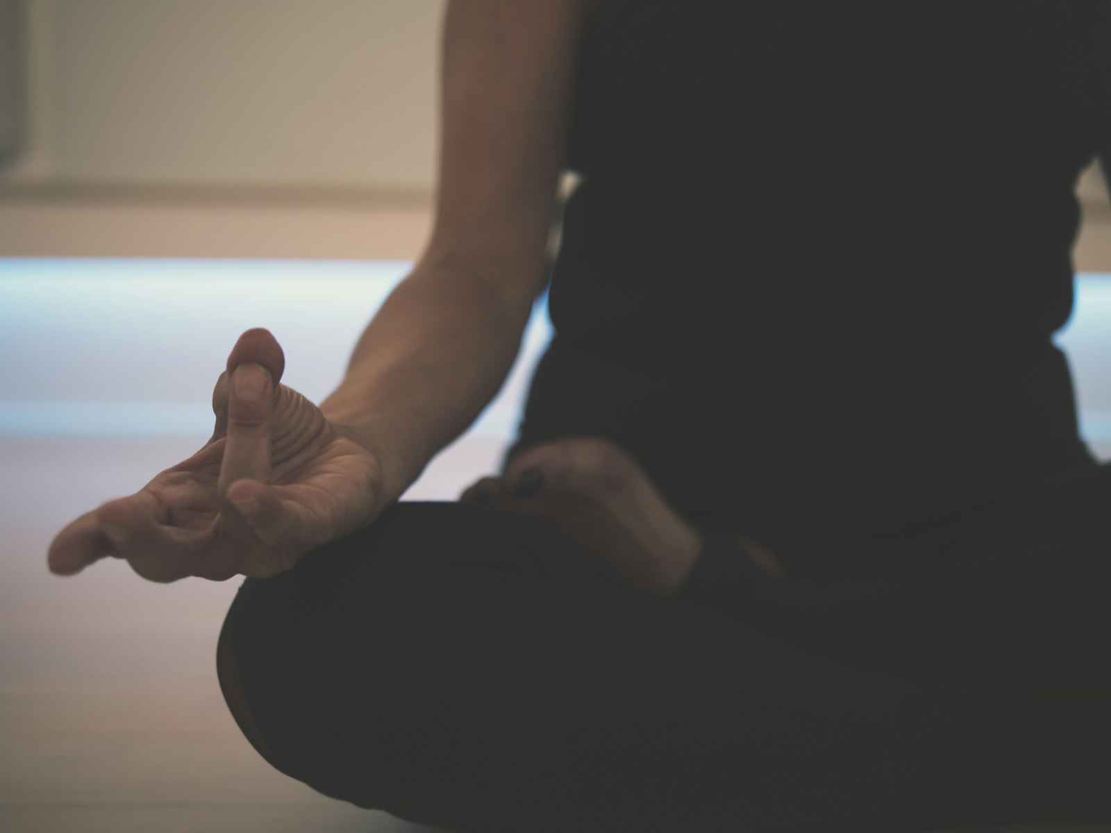 Quiet yin yoga shape held with a bolster